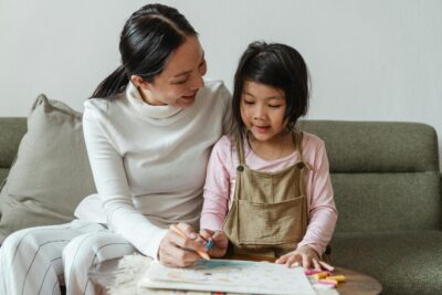 mother explaining to her daughter about age appropriate sex health