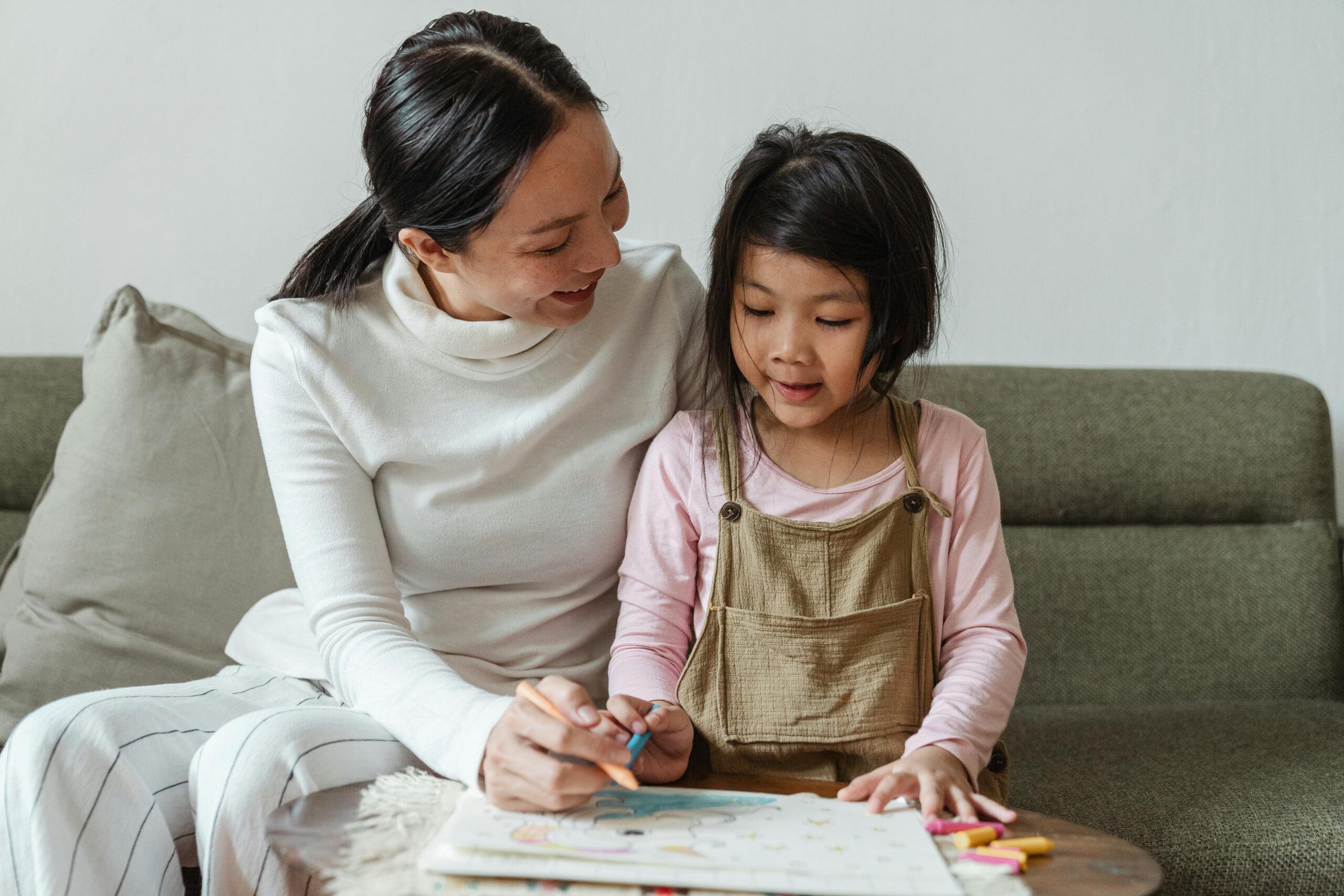 mother explaining to her daughter about age appropriate sex health