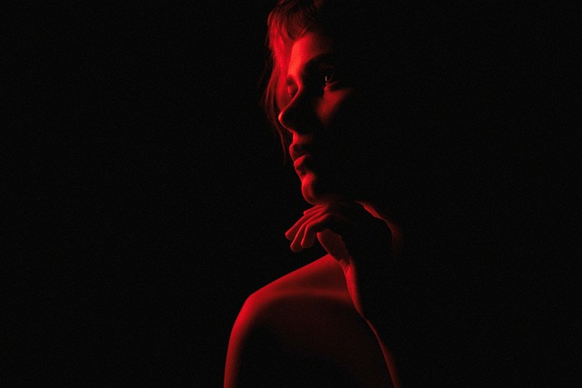 photo of a woman under red lighting