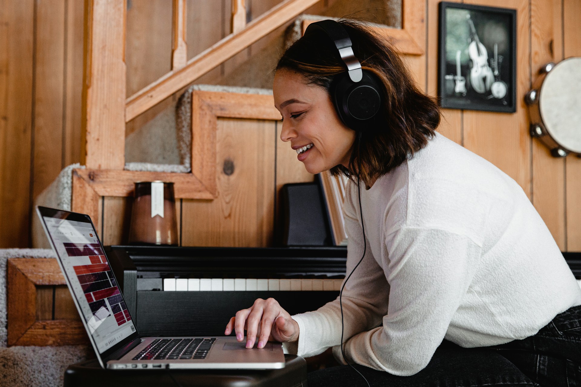 A happy woman with headphones on a laptop call. A vital part of dating a Filipina long distance is regular video chats and digital quality time.
