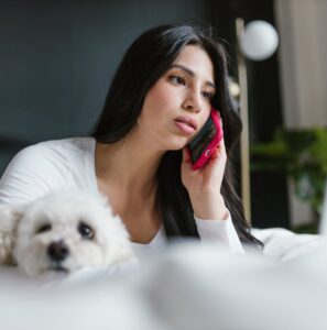 A Filipina on a phone call with her partner. Clear communication is the foundation for any successful long distance relationship Philippines.