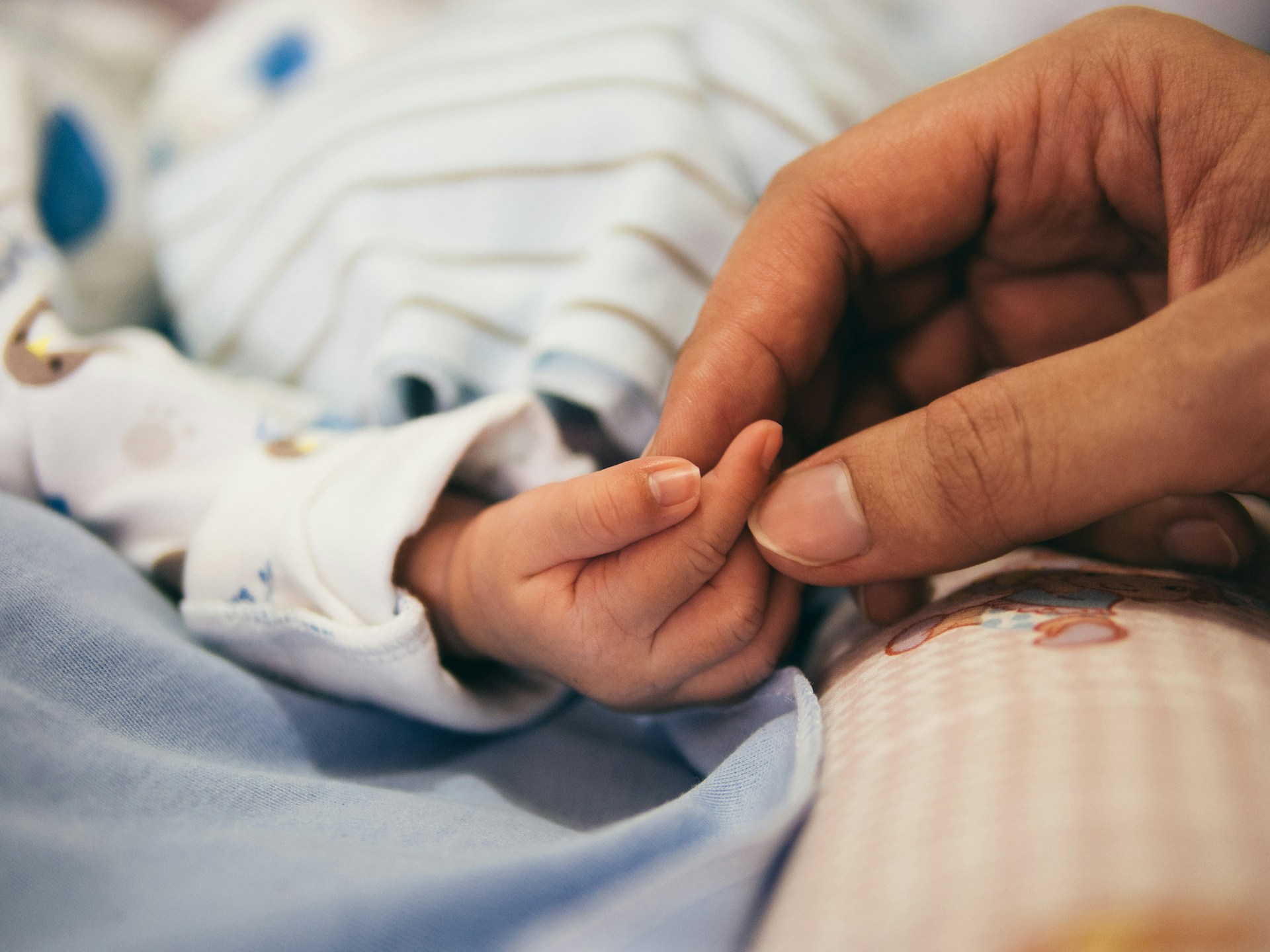 Close-up of a newborn’s hand. Many Filipino superstitions about pregnancy focus on protecting the infant from unseen spirits and urban legends.
